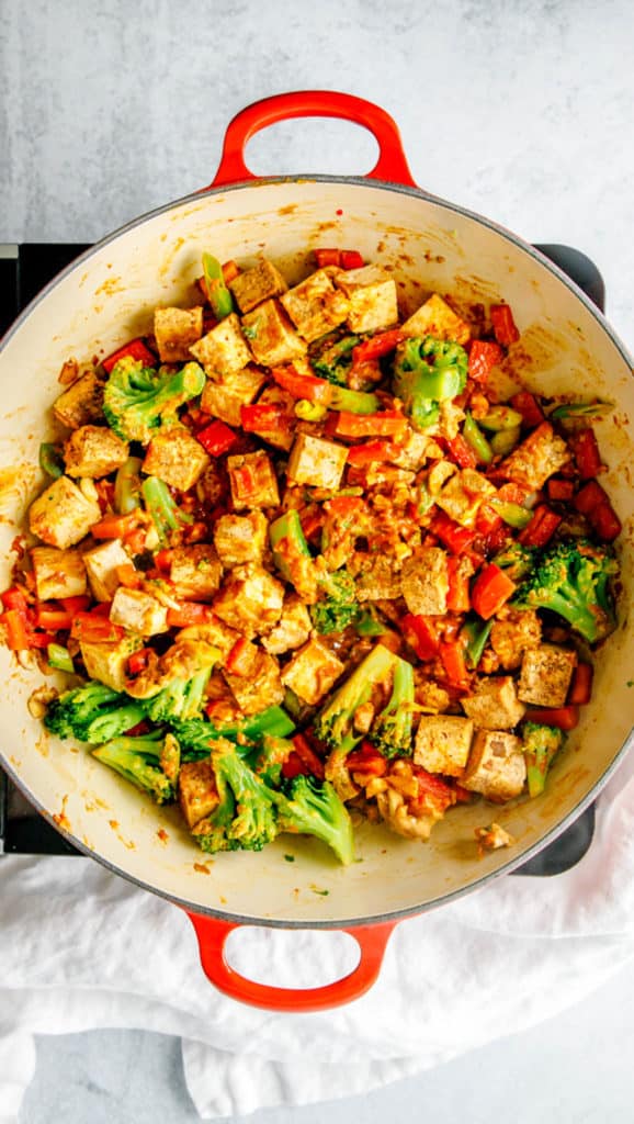 tofu and broccoli and sauce in a pot