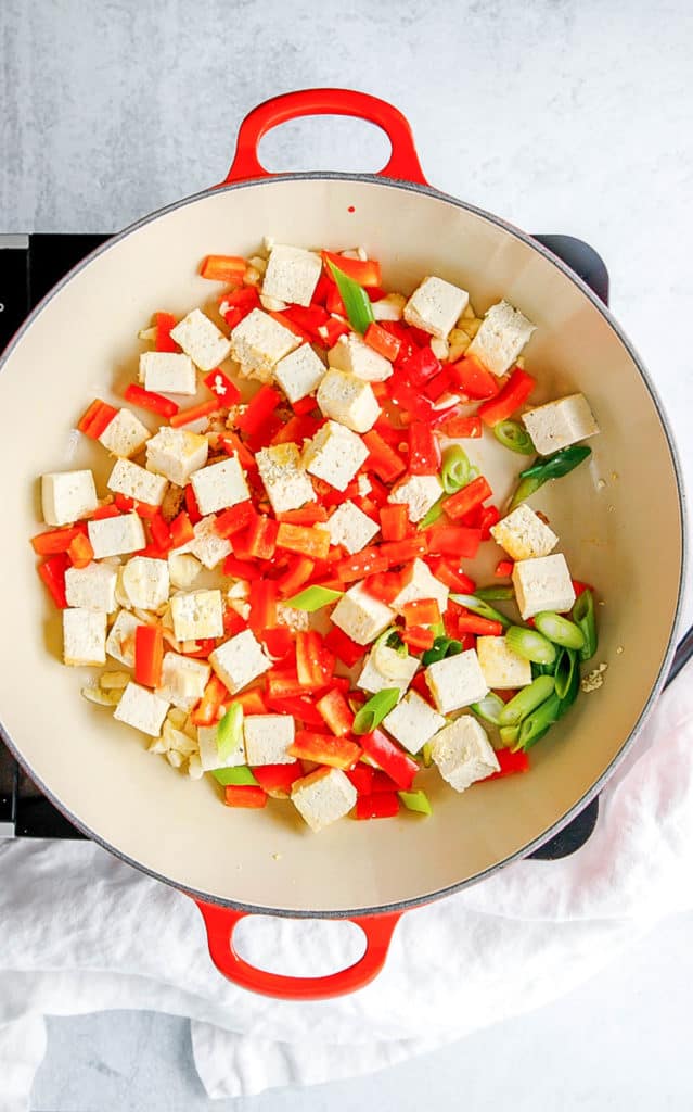 tofu and veggies sauteeing in a pot