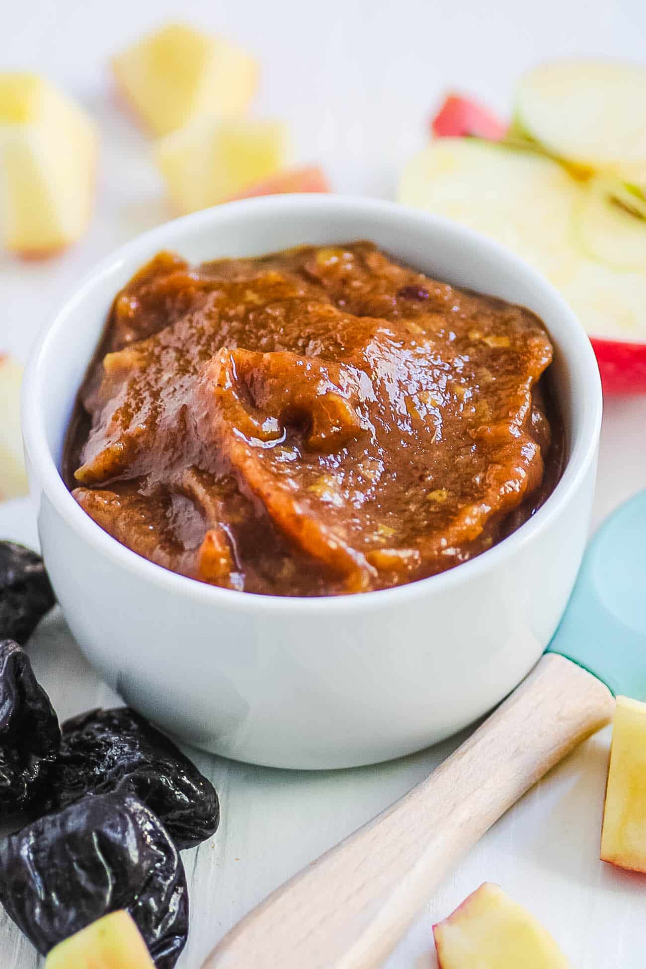 prune baby food puree served in a white bowl