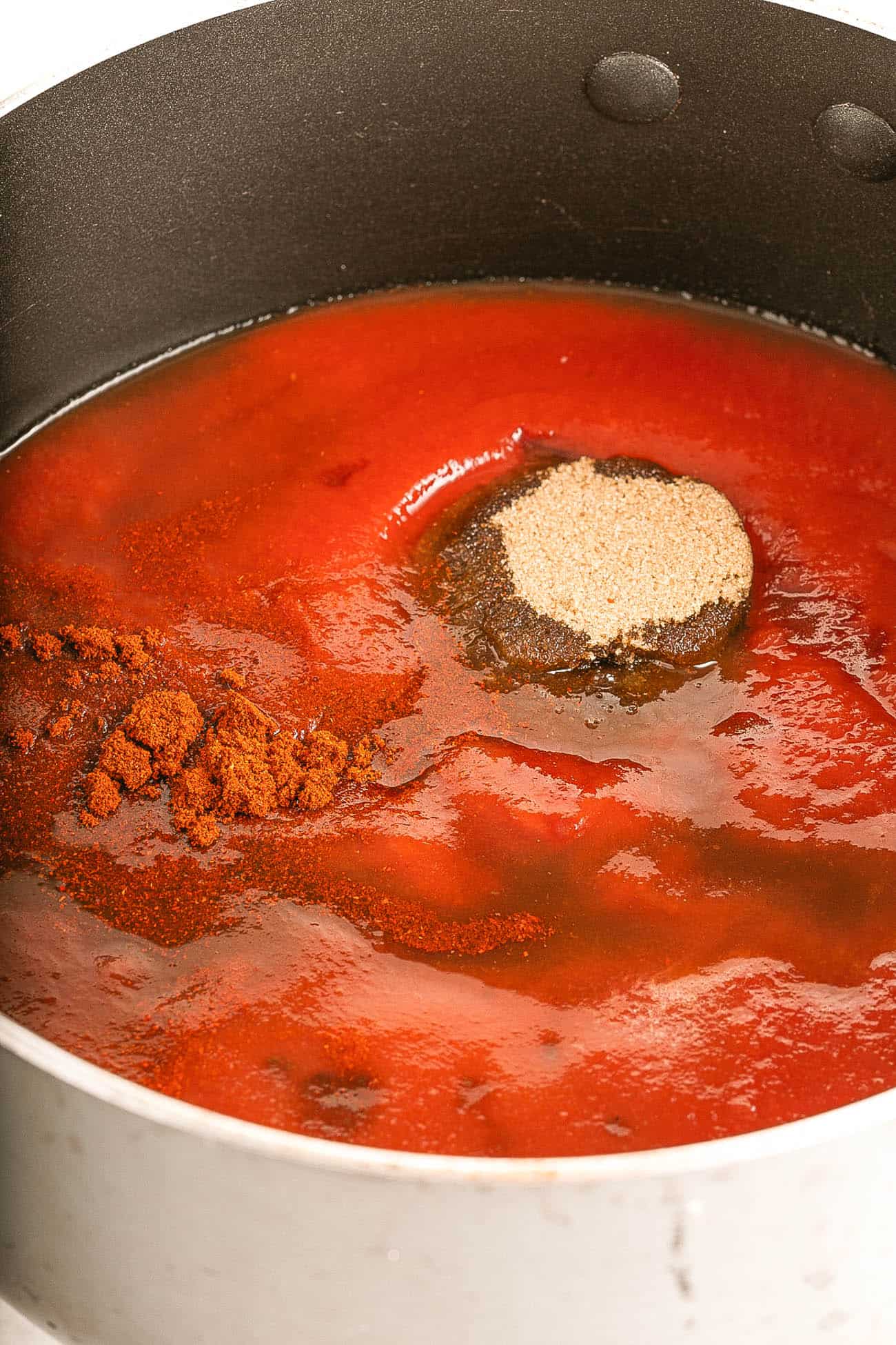 tomato sauce and spices in a pot