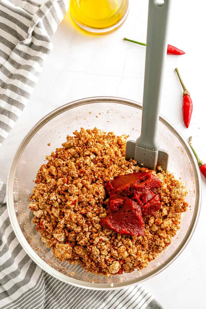 spices and tomato paste added to tofu