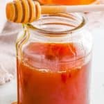 Vegan honey in small glass jar.