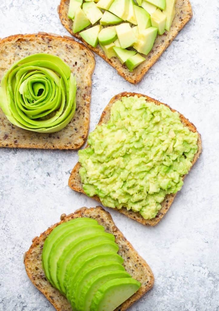 Four different kinds of avocado toast. 