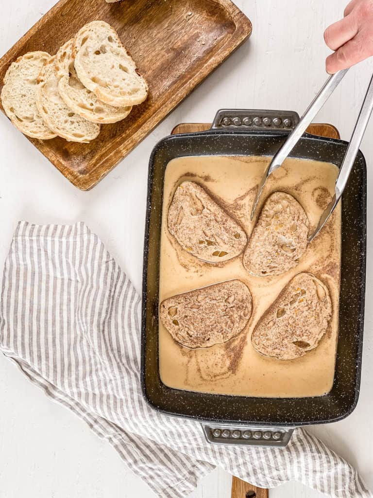 bread slices being dipped into egg mixture