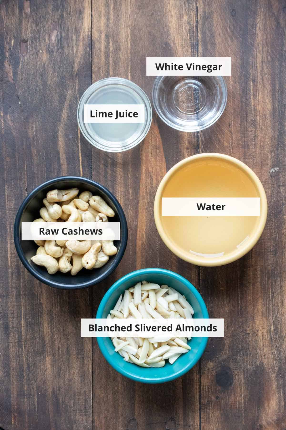 Ingredients for homemade vegan yogurt on a wood background.
