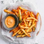 air fryer frozen french fries on a plate with ketchup