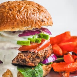 chipotle black bean burgers with tahini sauce and sweet potato fries