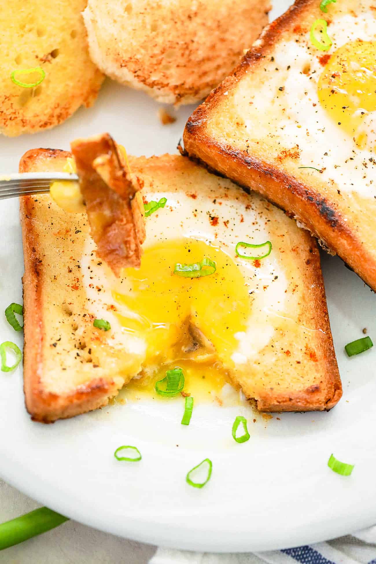 eggs in a basket - a classic breakfast served on a white plate