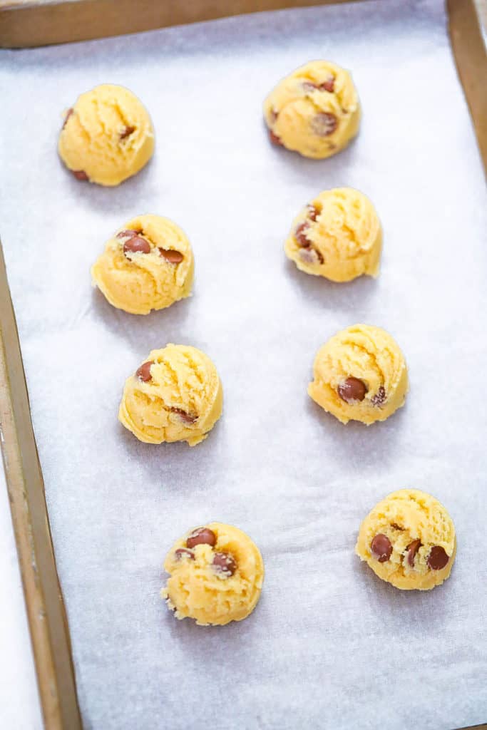 cookie dough balls on a baking shete