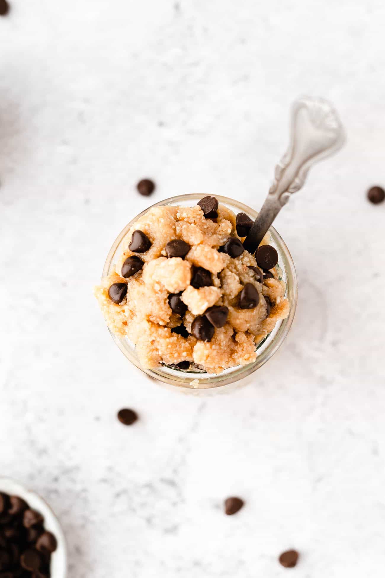 healthy edible cookie dough recipe in a glass jar with a spoon