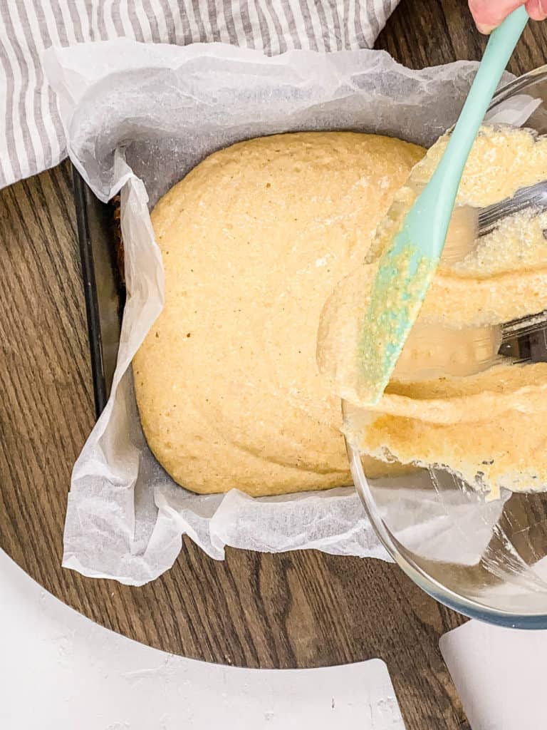 batter being poured into a baking diwh