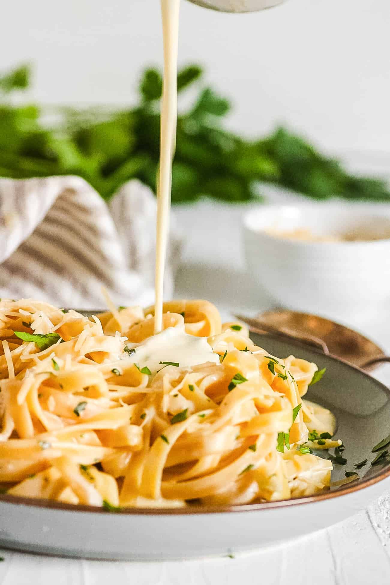 alfredo sauce without heavy cream drizzled over fettuccine pasta