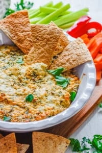 healthy cheese dip - easy kale dip recipe with pita chips in a white bowl