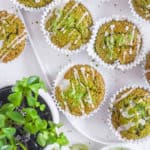 easy healthy matcha muffins recipe on a white plate with lemon frosting