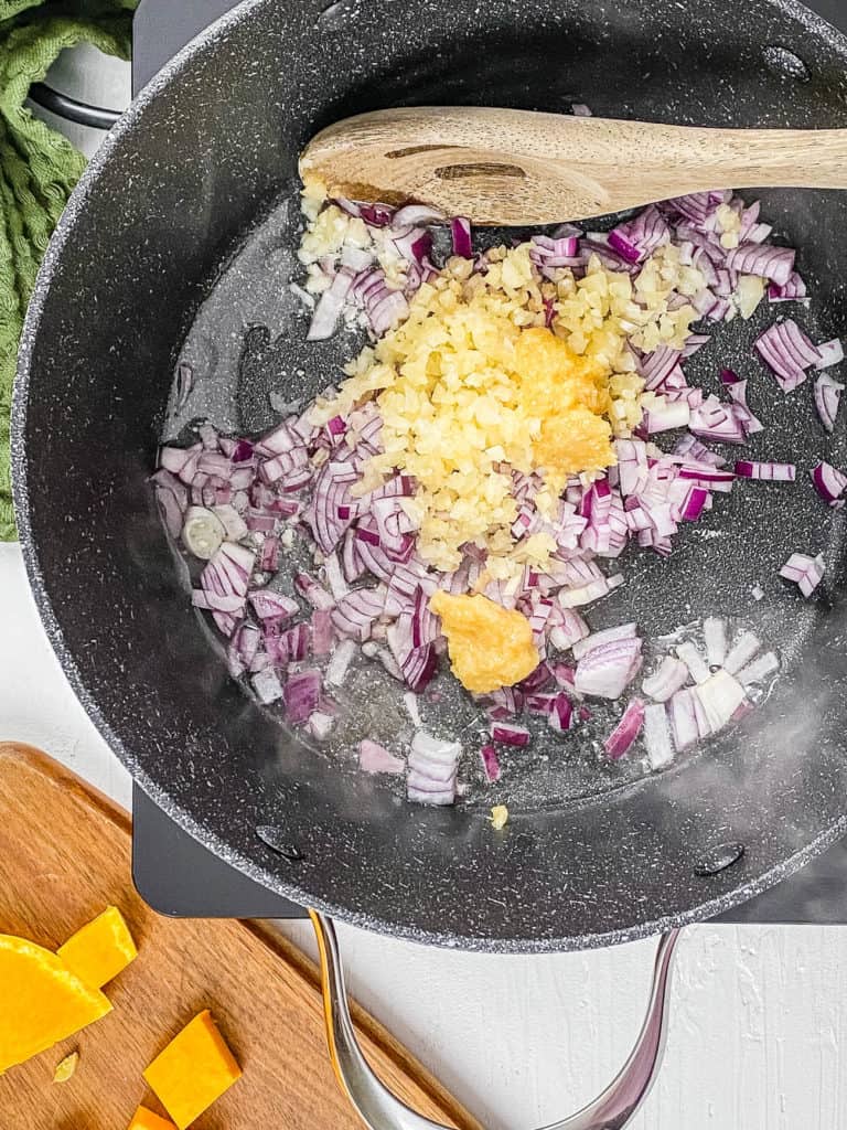 onions sauteeing in a pot