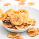 healthy easy air fryer banana chips in a white bowl