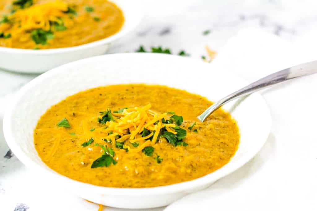 easy healthy instant pot broccoli cheddar soup recipe in a white bowl