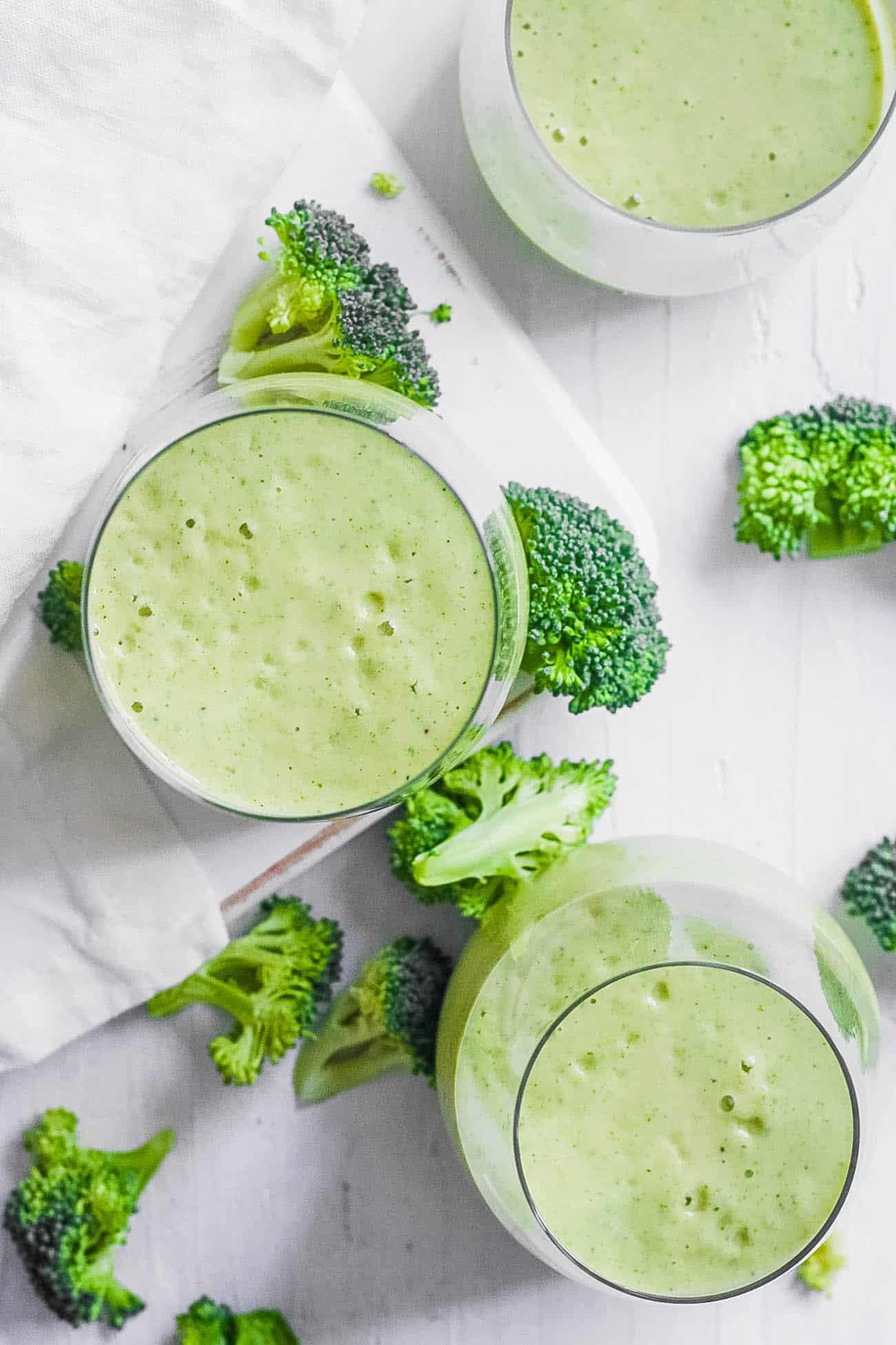 easy healthy vegan gluten free broccoli smoothie recipe with banana in a glass