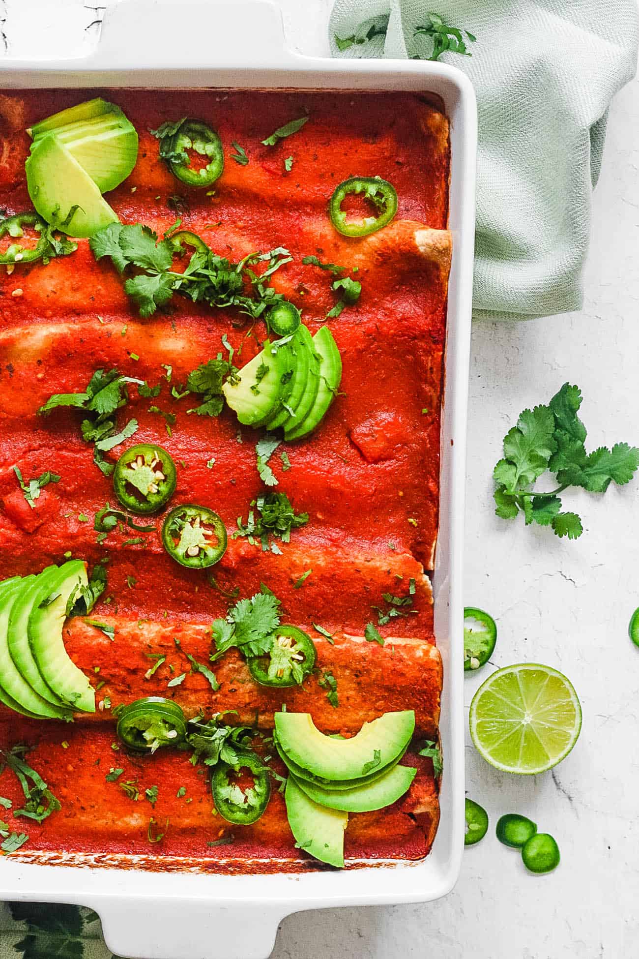 easy healthy vegan enchilada casserole recipe in a white baking dish