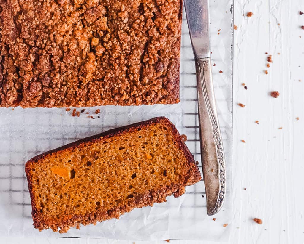 top view of gluten free pumpkin bread - pumpkin coffee cake - on a wire rack