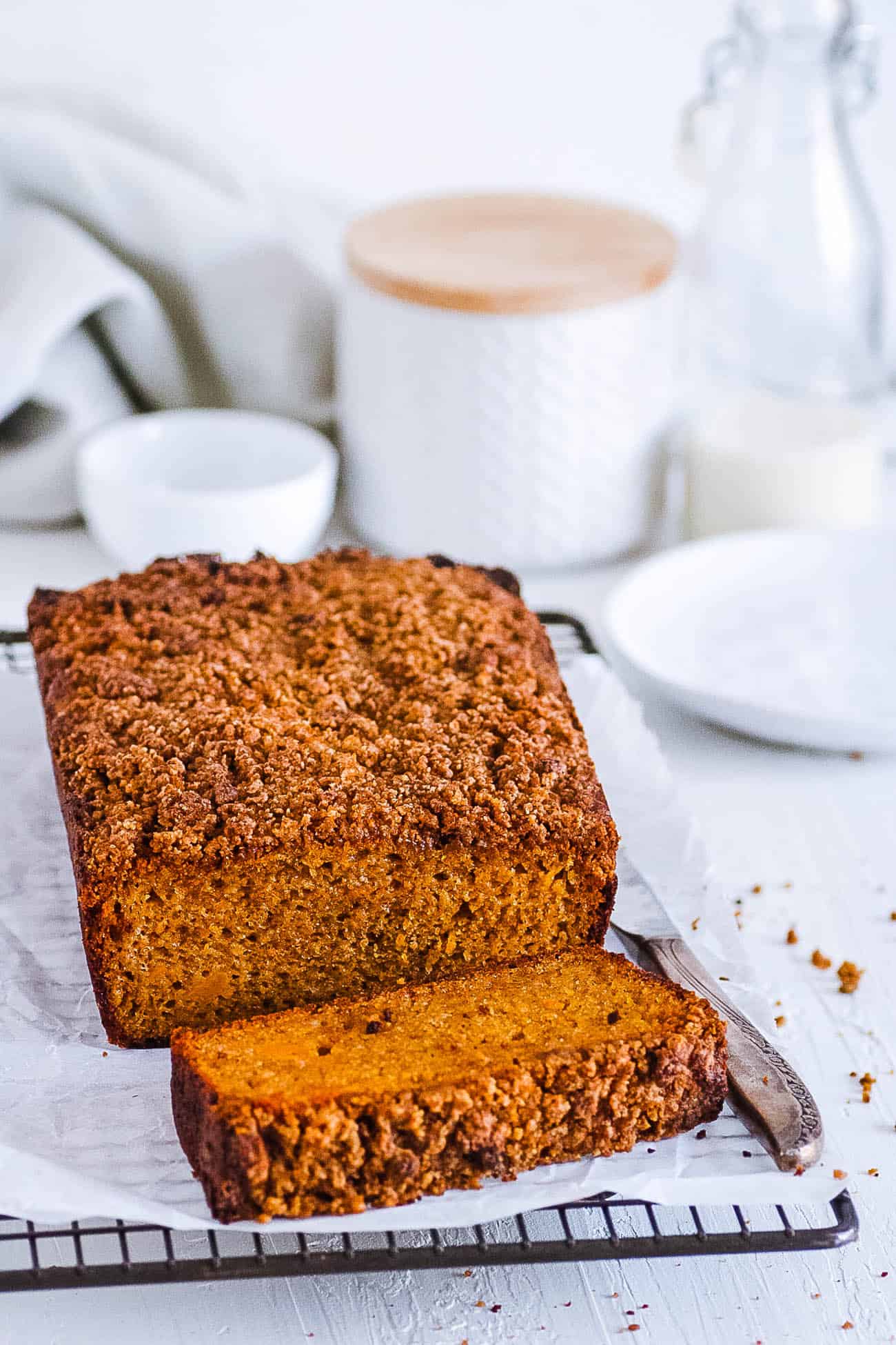 Gluten free pumpkin bread - pumpkin coffee cake - on a wire rack.