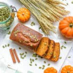 healthy easy vegan pumpkin bread gluten free - on a white background with pumpkin seeds on top