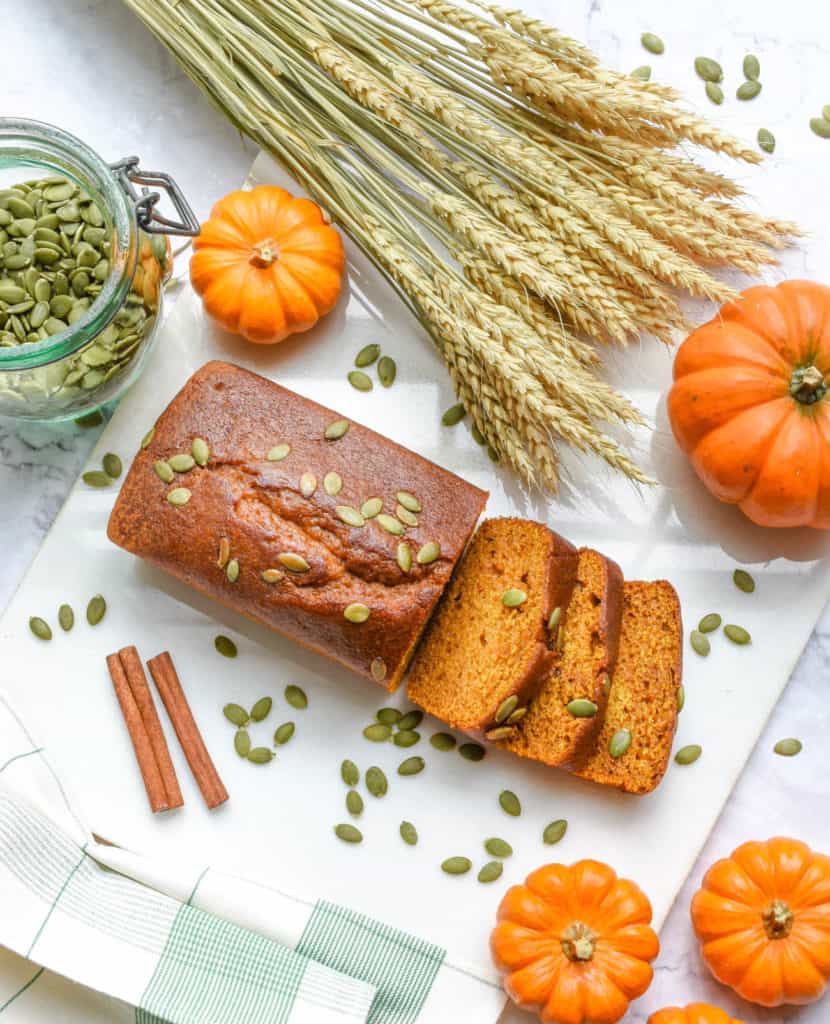 healthy easy vegan pumpkin bread gluten free - on a white background with pumpkin seeds on top - plant based breakfast ideas