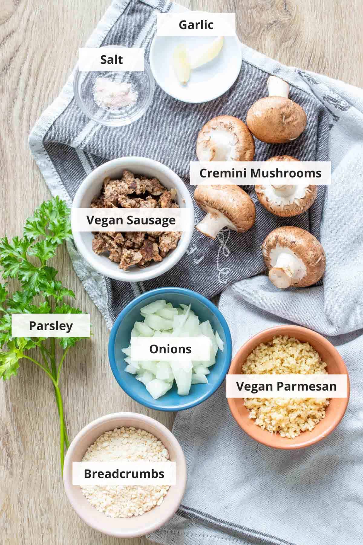 Ingredients for vegan stuffed mushrooms on a countertop.