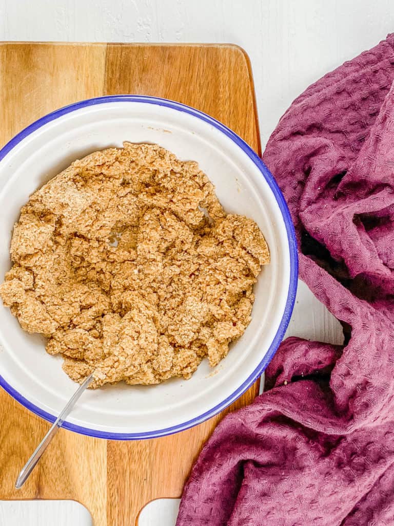 Vegan graham cracker dough mixed in a bowl.
