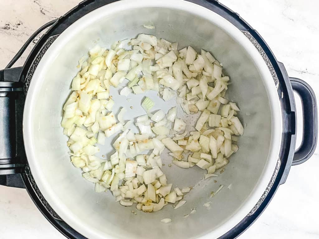onions sauteeing in a pot