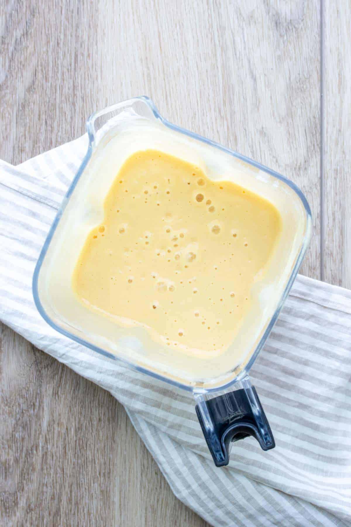 Dairy free cheese sauce blended in a blender.