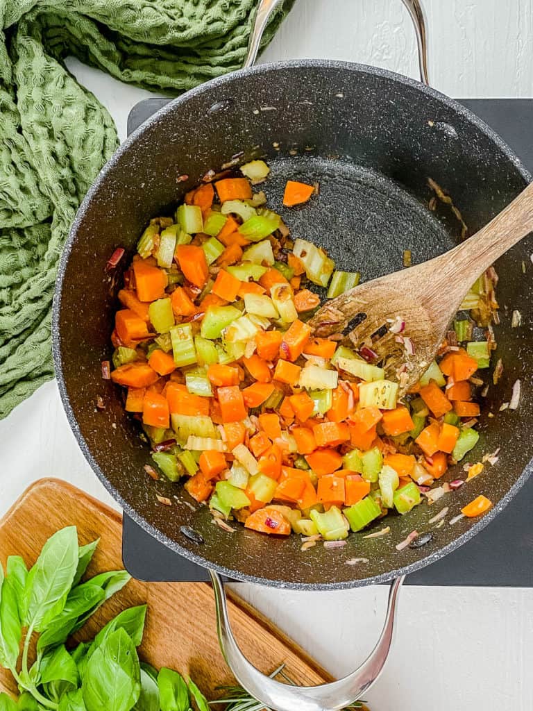 veggies sauteeing in a pot