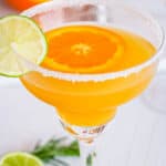 easy italian margarita recipe with amaretto and orange juice - cocktail served in a margarita glass