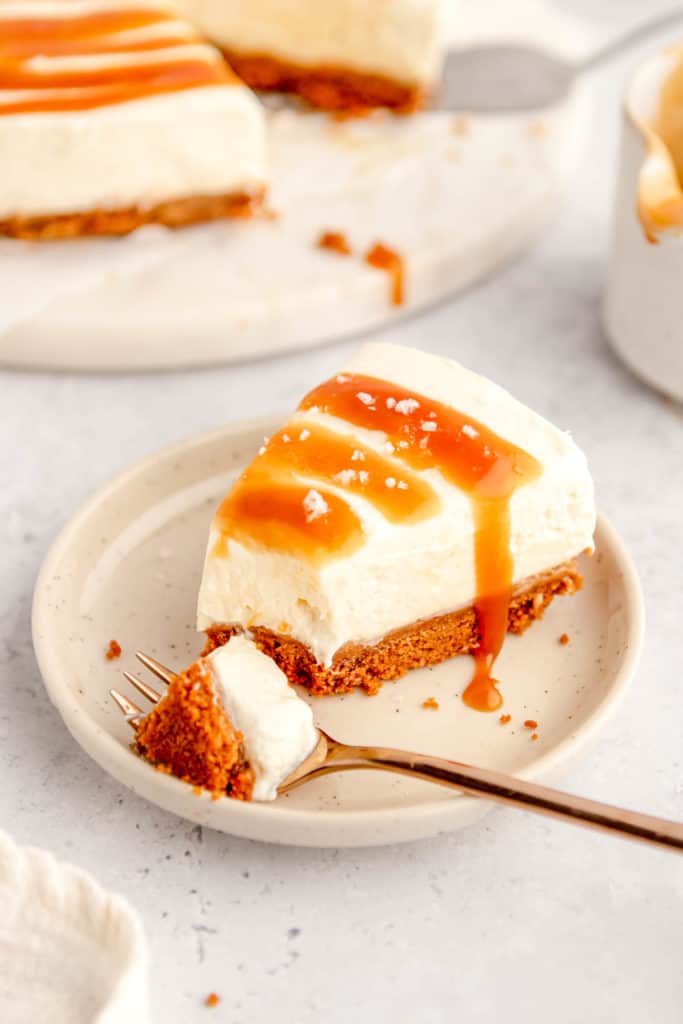 slice of easy salted caramel cheesecake no bake recipe with a bite taken out of it