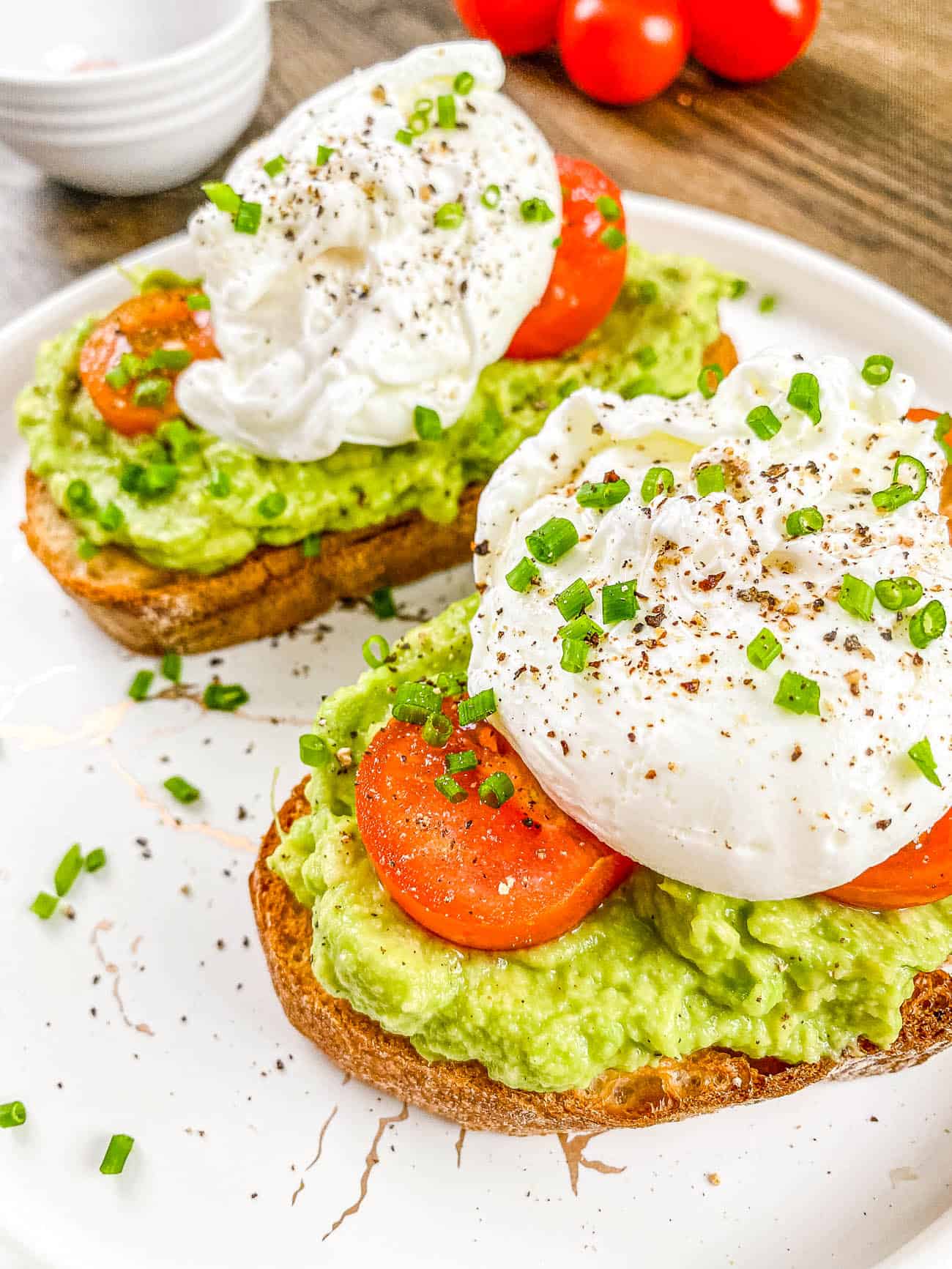 easy homemade healthy avocado toast with tomato and egg on a plate