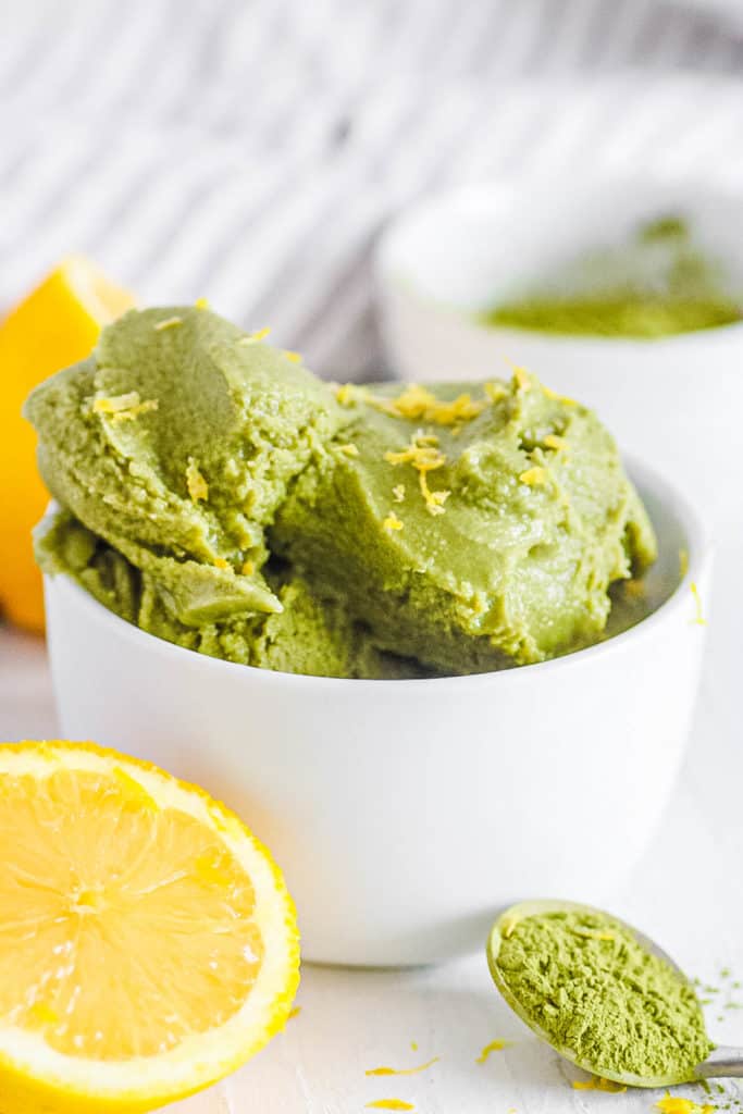 easy homemade vegan matcha ice cream recipe in a white bowl with lemon zest (non dairy ice cream)