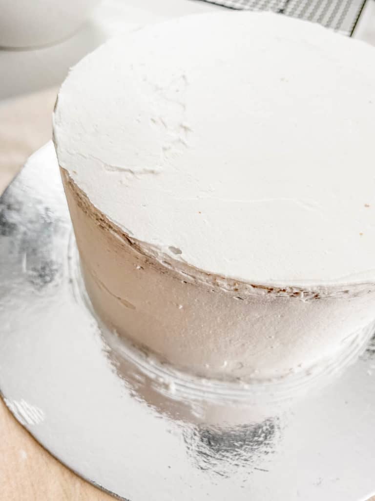 white icing spread onto cake