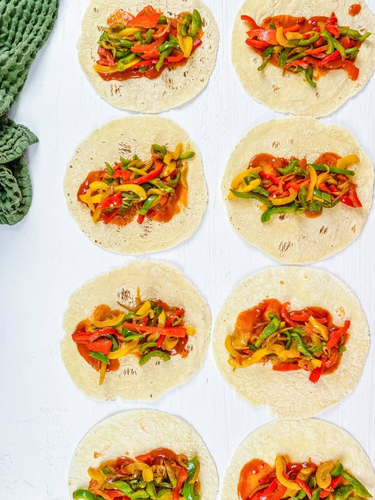 tortillas topped with sauce and veggies