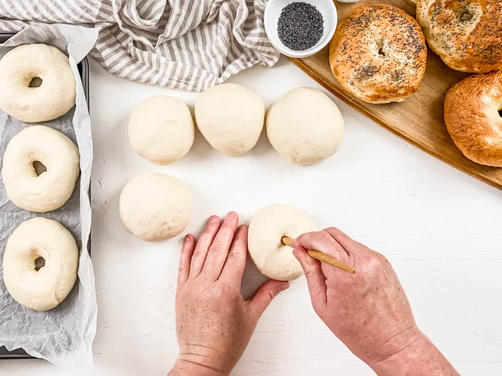 holes poked in dough balls on a cutting board