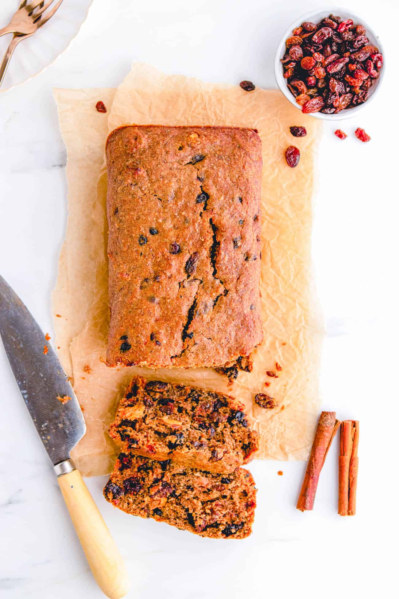 easy healthy vegan fruit cake recipe sliced on parchment paper