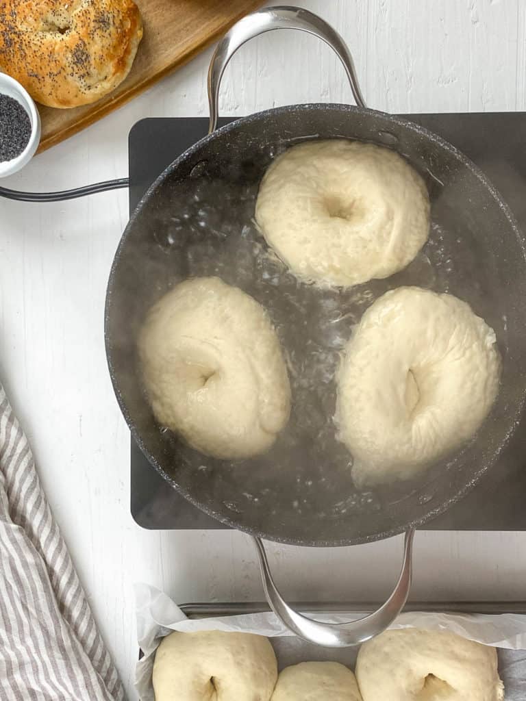 bagels boiling in a water bath