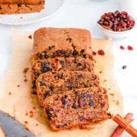 easy healthy vegan fruit cake recipe sliced on parchment paper