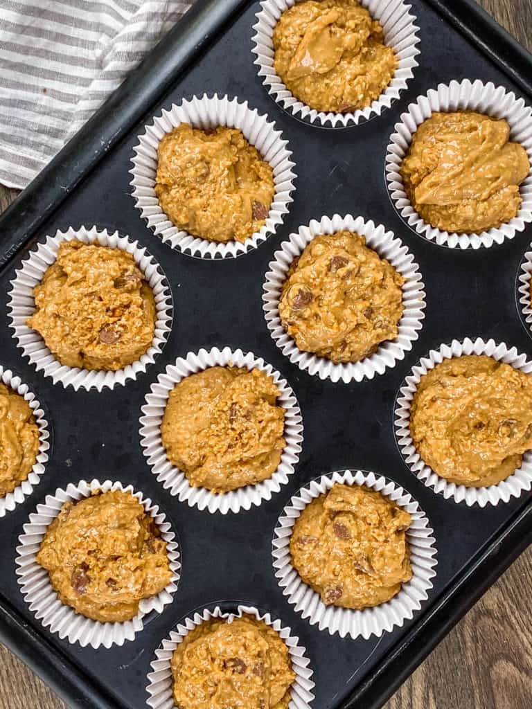 muffin batter in a baking tin