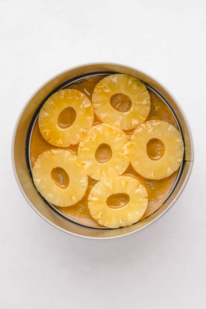 pineapples and maple syrup in a baking dish