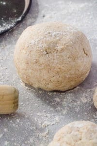 dough for low calorie pizza base on a work surface