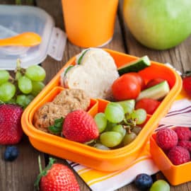 best healthy road trip snacks for kids - Lunch box with sandwich, cookies, veggies and fruits