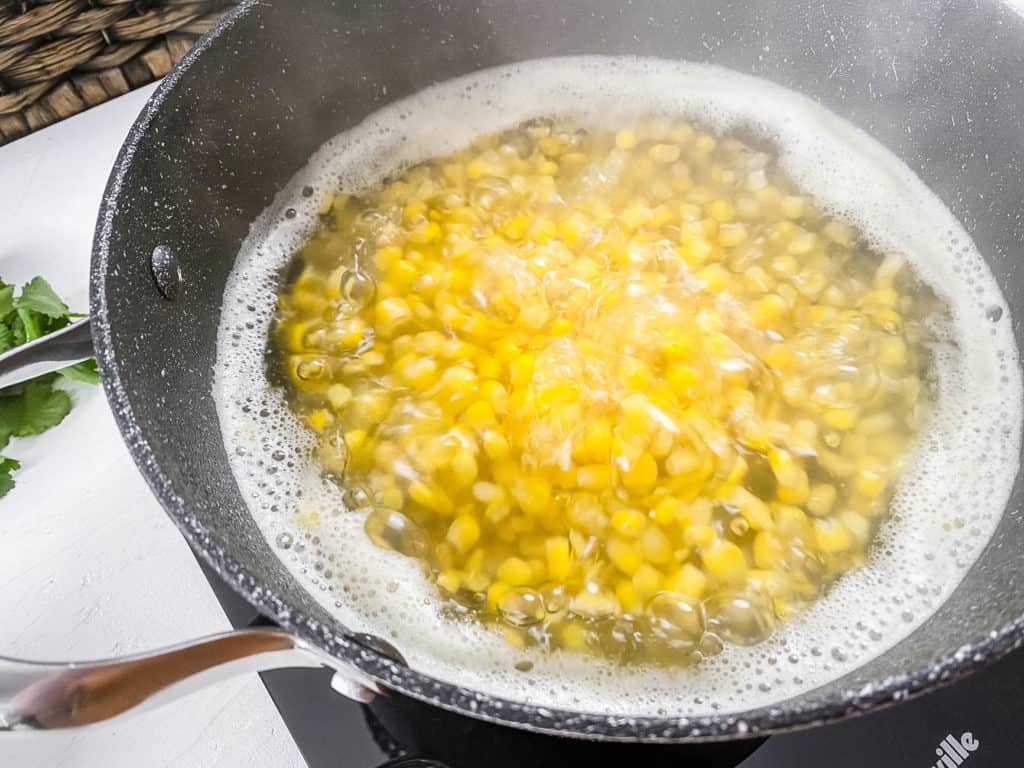 steamed corn in a pot