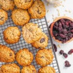 Healthy sugar free oatmeal cookies with raisins stacked on a wire rack.