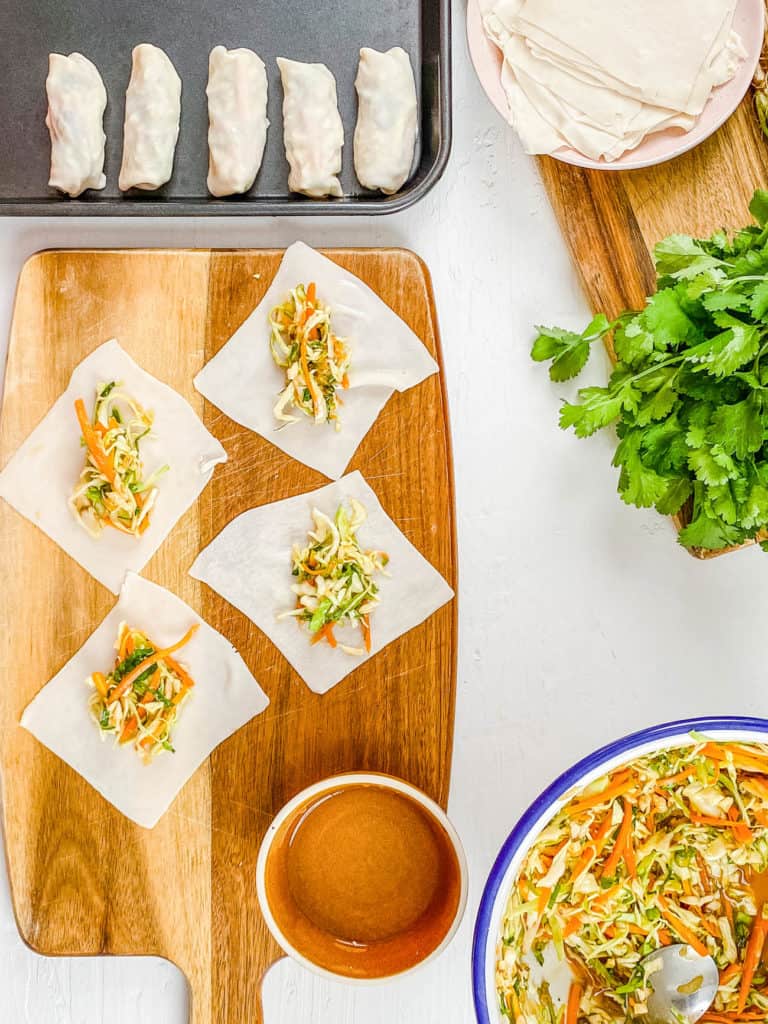 egg roll wrappers on a cutting board