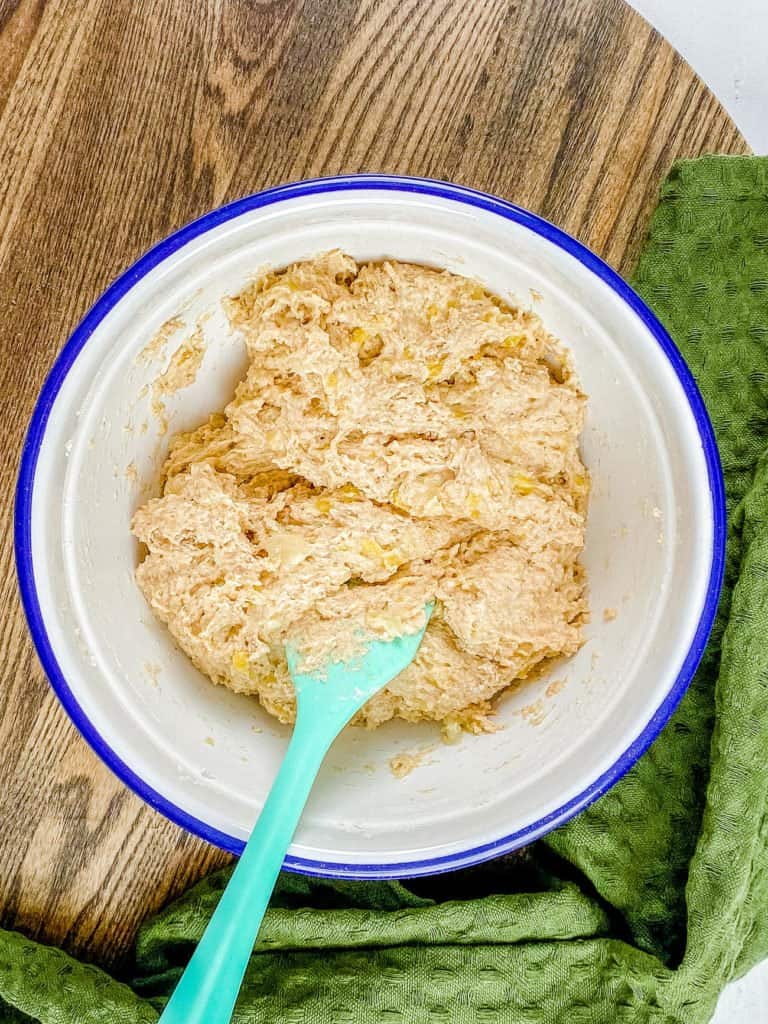 Mixing up the healthy smash cake batter in a mixing bowl.